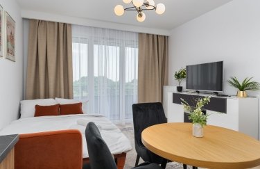 Половина квартир у сегменті до $60 тис. – однокімнатні. / Pexels кімната меблі інтер'єр стіл ліжко телевізор вікно