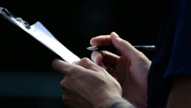 a close up of a person holding a cell phone